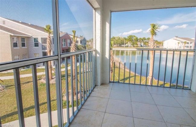 Balcony with a water view and a residential view | Image 19