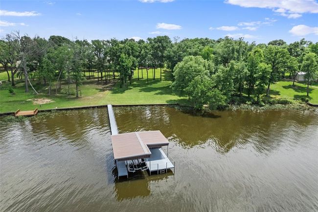 View of dock with a yard and a water view | Image 33