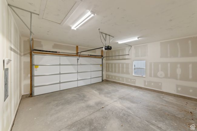Garage with a garage door opener | Image 20