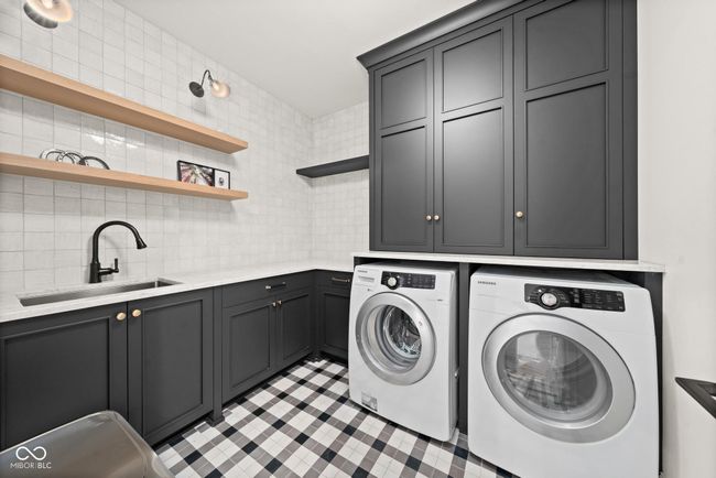 Upper level laundry room with sink | Image 52