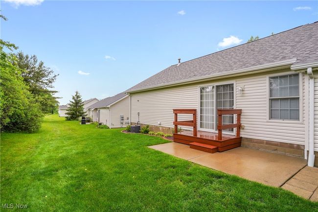 View of green lawn featuring a patio | Image 24