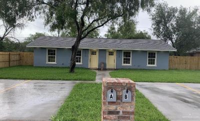 Ranch-style home featuring a front yard | Image 1