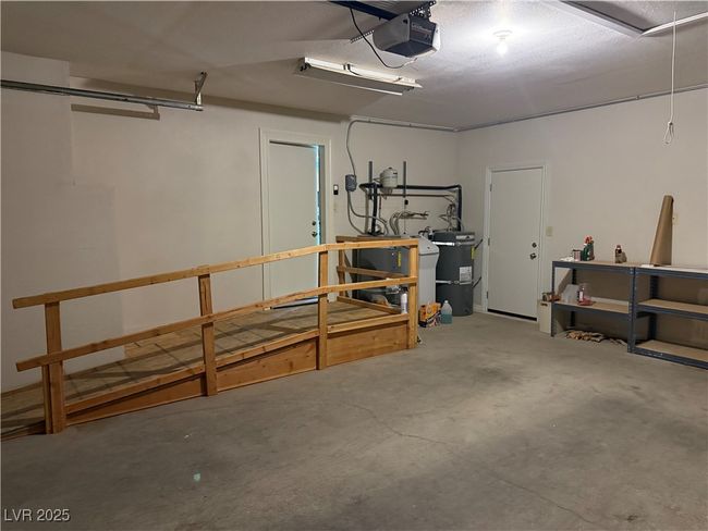 Garage with a garage door opener | Image 25