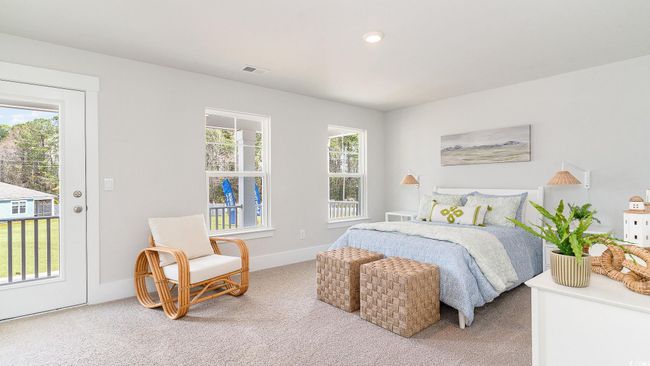 Bedroom with multiple windows, light colored carpet, baseboards, and access to exterior | Image 26