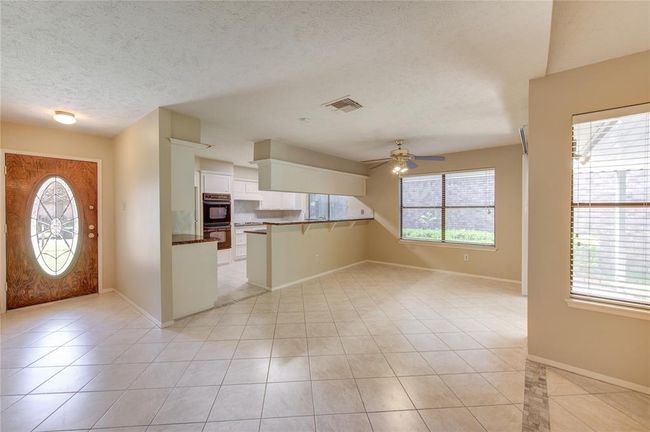 Inviting entry way leads to the family, dining, and kitchen. | Image 4