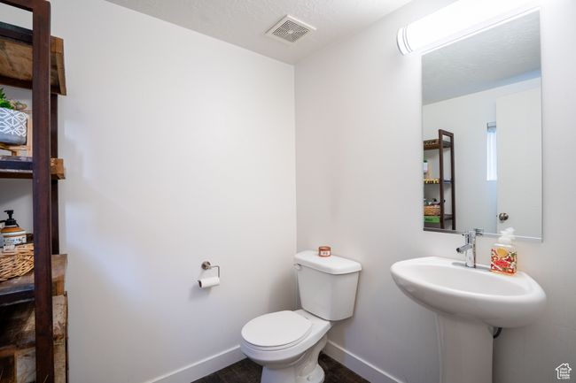 Bathroom with toilet and wood finished floors | Image 15