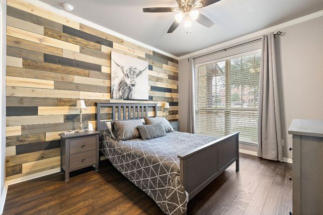 Secondary bedroom on main floor with attached full bath | Image 12