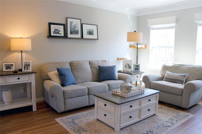 Living area with wood finished floors and ornamental molding | Image 4
