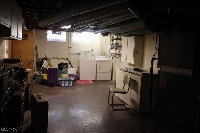 Below grade area featuring washing machine and clothes dryer | Image 18