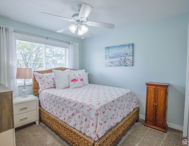 Carpeted bedroom featuring a ceiling fan | Image 13