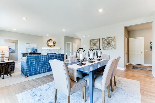 The dining space flows the opposite direction in an oversized family room! Photo of model home, color and options will vary. | Image 12