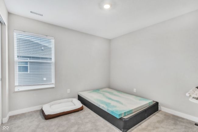 bedroom with visible vents, baseboards, and carpet flooring | Image 30
