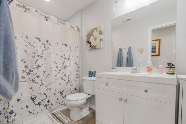Bathroom featuring visible vents, tile patterned flooring, vanity, and toilet | Image 23