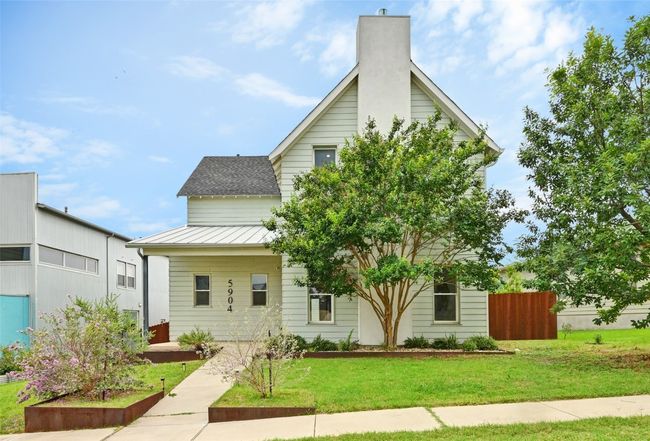 View of front of house featuring a standing seam roof, a metal roof, and a chimney | Image 27