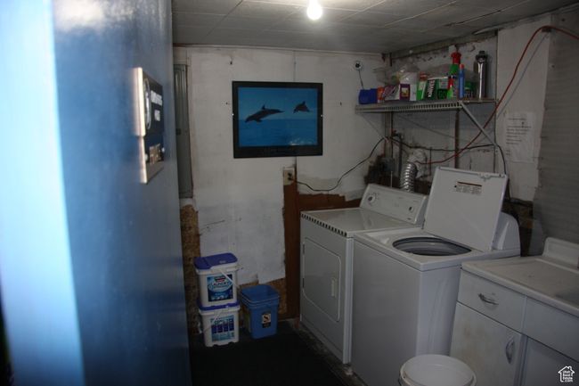 Clothes washing area with separate washer and dryer and cabinet space | Image 6