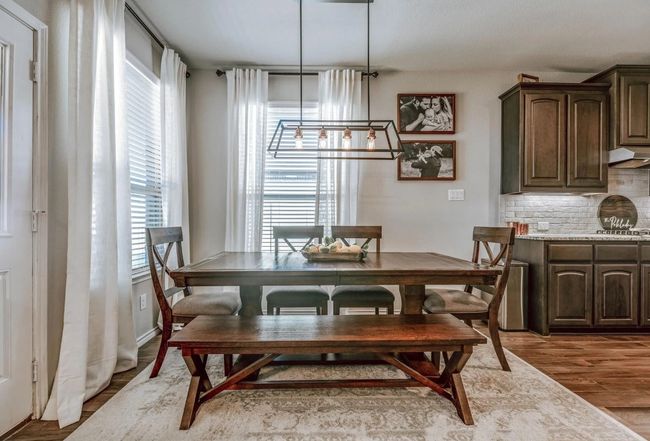Dining space with wood finished floors | Image 20
