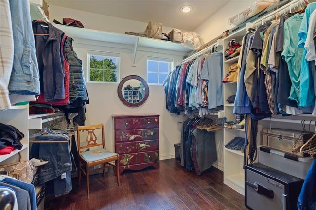 Spacious closet featuring hardwood / wood-style floors | Image 15