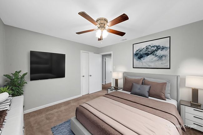 Bedroom with carpet and a ceiling fan | Image 12