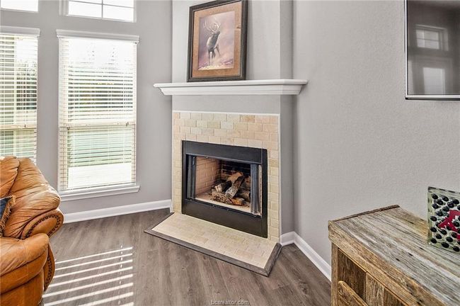 Details with a fireplace and wood-type flooring | Image 11
