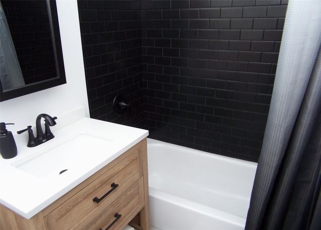 Bathroom with shower / tub combo with curtain and vanity | Image 10