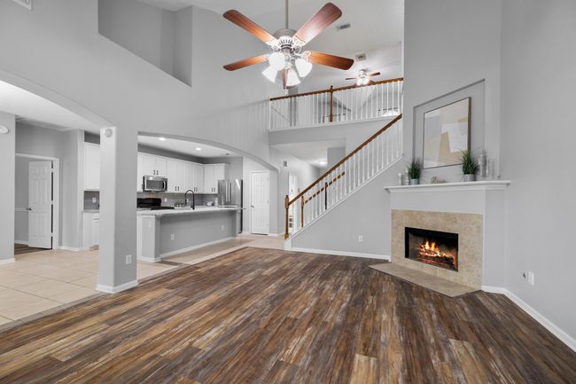 The open living room flows easily into the kitchen and dining spaces—perfect for everyday living or effortless entertaining. | Image 10