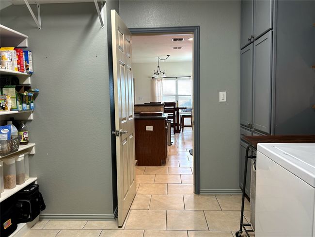 Looking into the kitchen from the laundry room. | Image 13