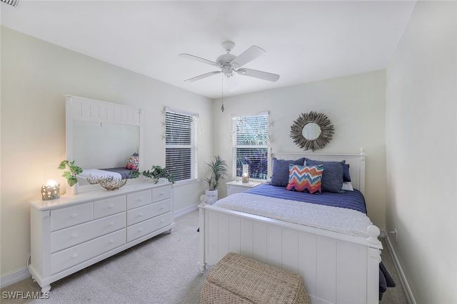 Carpeted bedroom featuring ceiling fan | Image 14