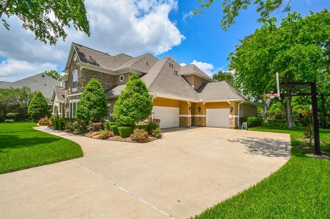 Entrance to your estate to your 3-car driveway with plenty of space for extra parking for your guests. | Image 4