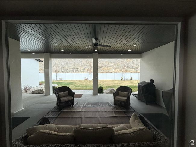 View of patio / terrace featuring fence and ceiling fan | Image 50