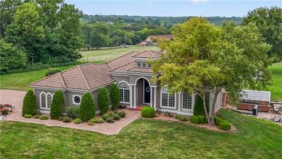 Mediterranean / spanish house featuring a front yard | Image 2