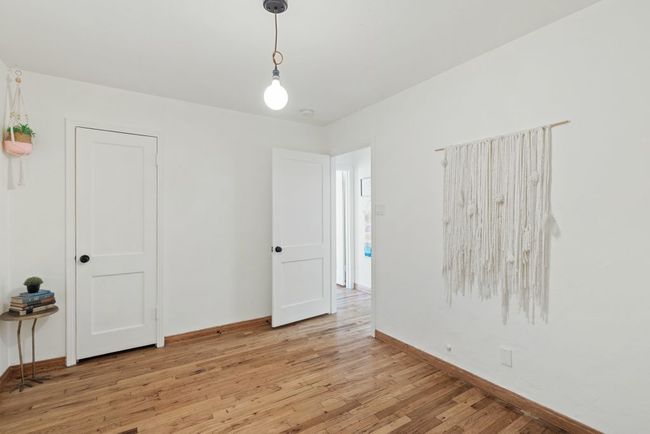 Spare room with light wood-type flooring and baseboards | Image 7