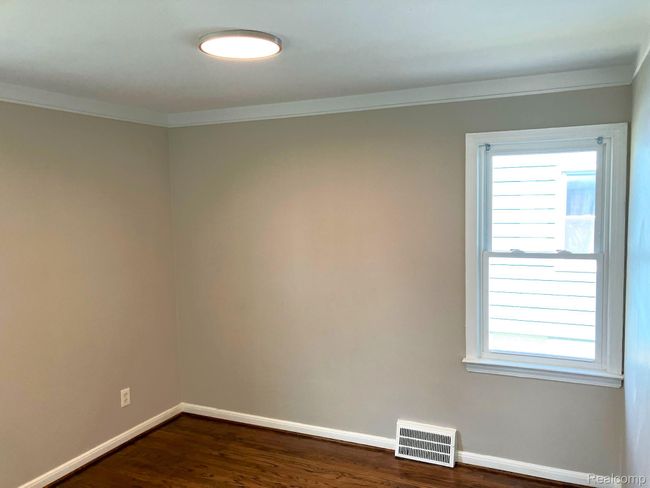 Bedroom 1 also with fresh paint & freshly refinished wood flooring. | Image 10
