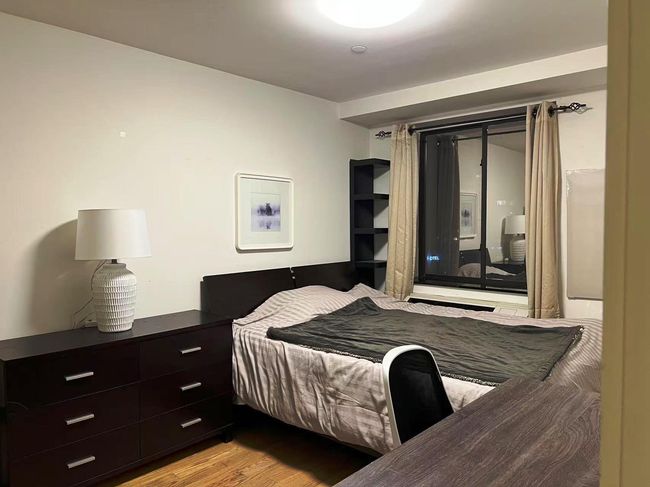 Bedroom with light wood-type flooring | Image 7