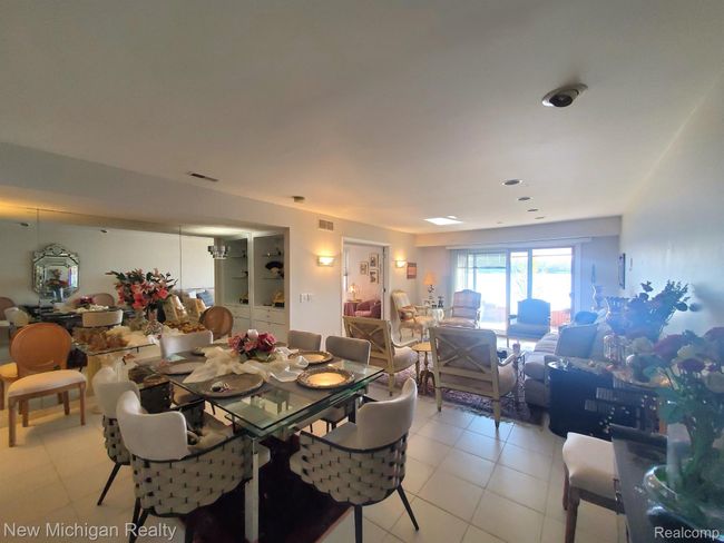 Open living area filled w day light & water views | Image 6