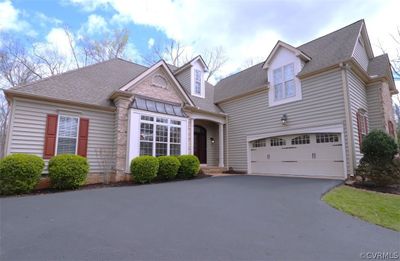 View of front facade featuring a garage | Image 1