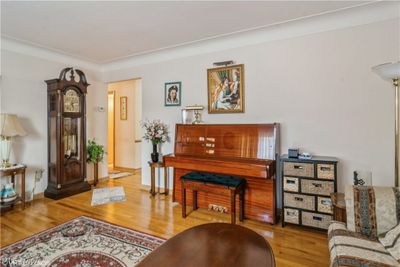 View to bedroom hallway. Note all the floors are hardwood. Plus, the piano is offered for sale. In interested please ask. | Image 3