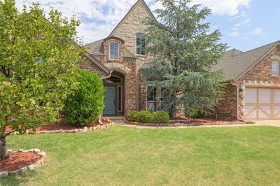 English style home featuring a front lawn | Image 3