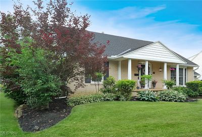 View of front of home featuring a front lawn and covered porch | Image 2