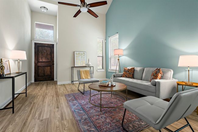 The high ceilings in the living room create an immediate sense of openness, making the entire space feel larger, brighter, and more connected to the outdoors | Image 7