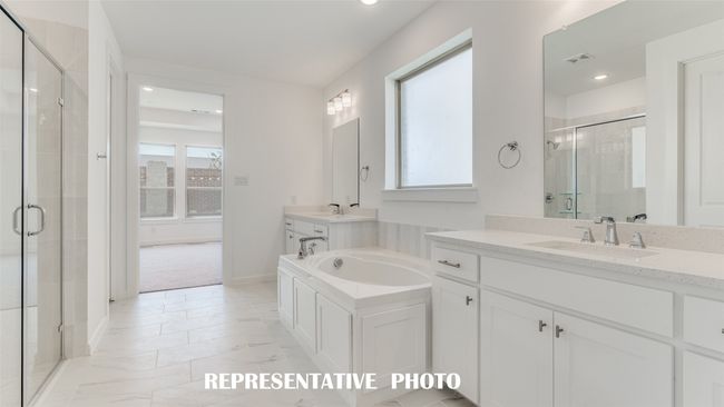 Plenty of room for two in this over the top owner's bath! REPRESENTATIVE PHOTO. | Image 11