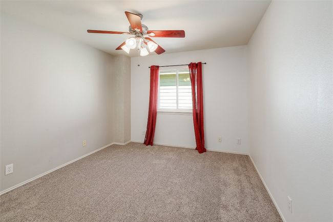 Empty room featuring carpet flooring, baseboards, and a ceiling fan | Image 20