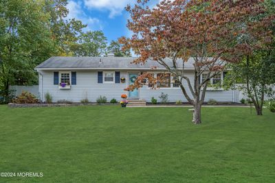 Meticulously maintained ranch in desirable Birchwood Park with beautiful grounds and a pool. | Image 2