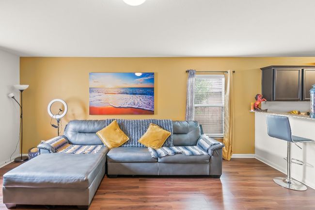 Living room with dark wood-type flooring | Image 11