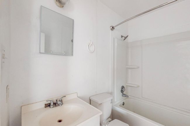 Bathroom with bathing tub / shower combination and vanity | Image 10