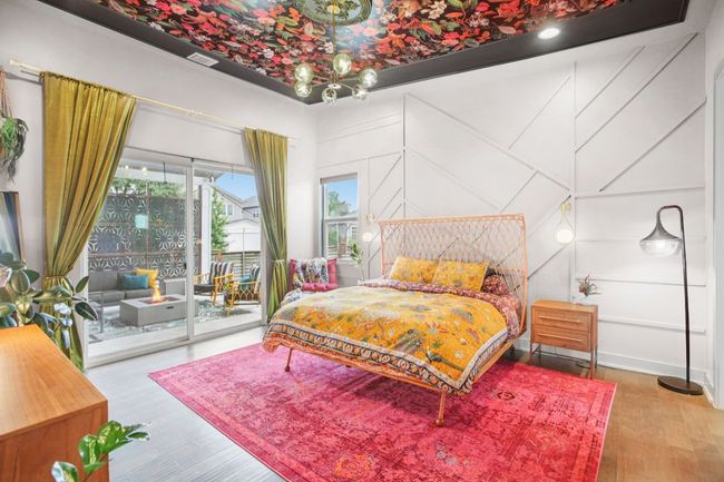 Bedroom with access to exterior and wood finished floors | Image 18
