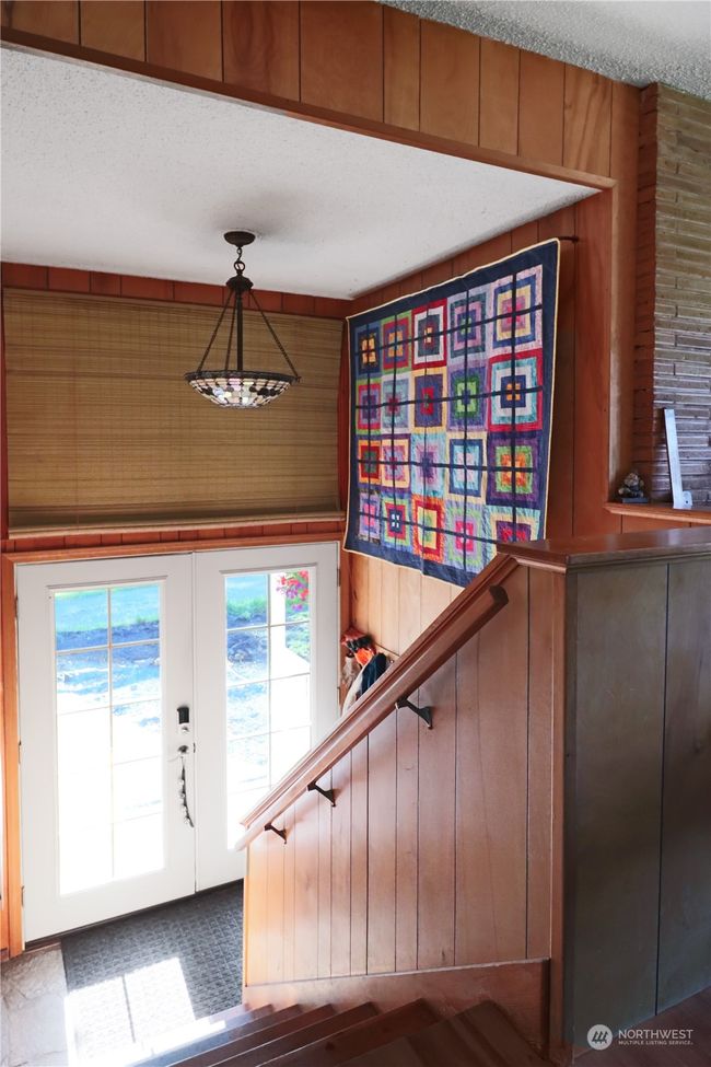 The entryway warmly welcomes you into this inviting home. It's the perfect introduction to a space designed for both relaxation and comfort | Image 13