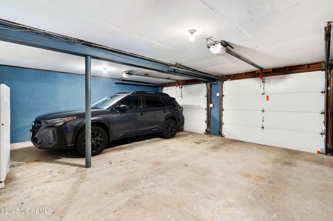 Large garage with room for storage and electric ready for your EV | Image 52