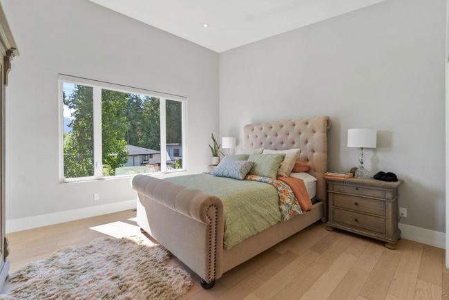 Bedroom featuring baseboards, light wood-style floors, and recessed lighting | Image 14