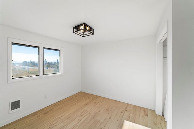 Unfurnished bedroom featuring light hardwood / wood-style floors | Image 23
