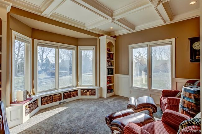 Home office with built in storage in the bay window seat, and custom ceiling details | Image 21